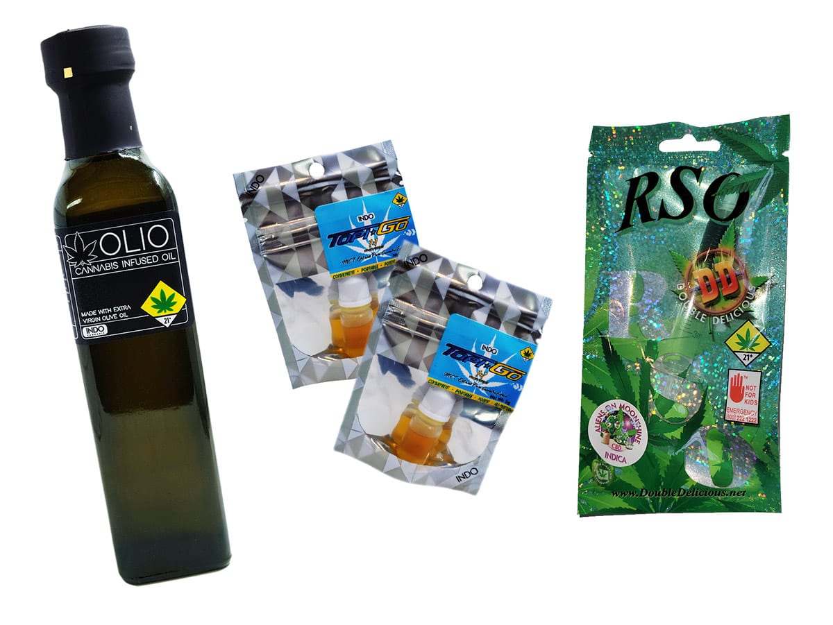 bottle of oil next to cannabis concentrates and other cannabis product | Dockside Cannabis