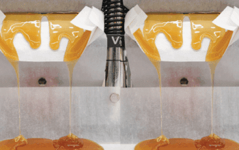 Constellation Cannabis Hash Rosin oozing out of a hydraulic press | Dockside Cannabis